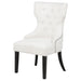 Cream and black upholstered CoasterEveryday dining side chair with fabric upholstery and a sleek, modern design.