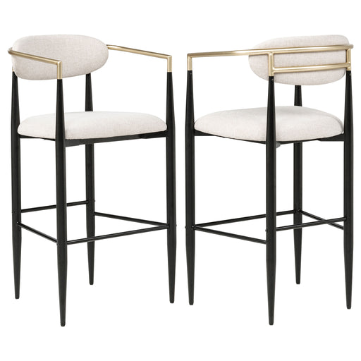 Two beige Tina fabric upholstered bar chairs with wooden legs, modern furniture by CoasterEveryday, shown from the side.