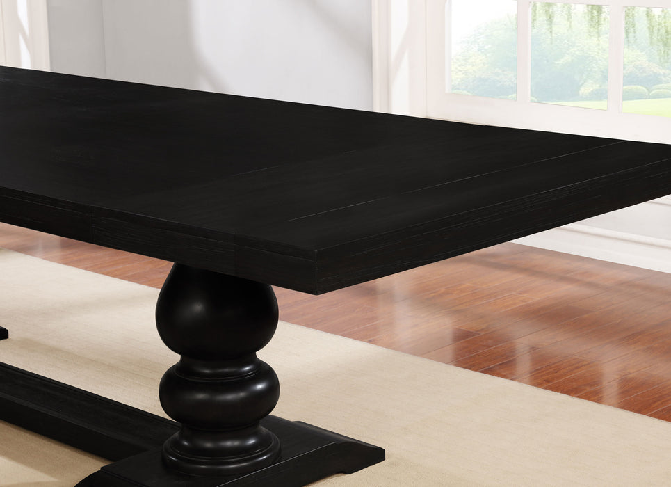 CoasterEssence Phelps 123-inch extension leaf dining table in distressed noir with a wooden finish and sturdy legs.