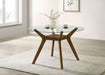 CoasterEveryday Paxton 48-inch round wood dining table with glass top and brown finish, showcasing sturdy wooden legs and sleek design.