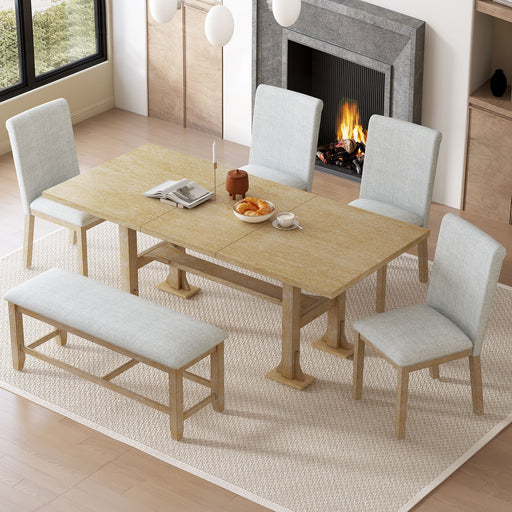 Giga Topmax 6-piece farmhouse extendable dining table set with trestle, removable leaf, upholstered chairs, and matching bench in a dining room.