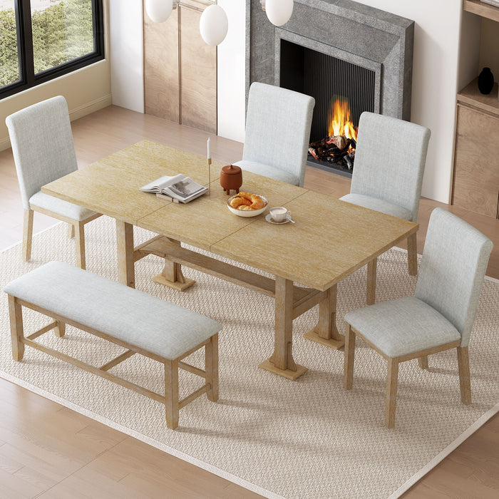 Giga Topmax 6-piece farmhouse extendable dining table set with trestle, removable leaf, upholstered chairs, and matching bench in a dining room.
