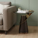 HomeRoots glass and stainless steel round pedestal end table with solid wood top in clear, rose, and gold finish.