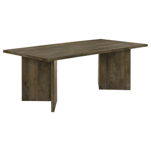 CoasterEveryday Tyler 80-inch solid wood dining table in mango brown with a sleek, rectangular design and sturdy legs.