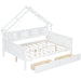 Giga house style platform bed with LED lights, built-in storage shelves, drawers, and guardrail in a modern bedroom setting.
