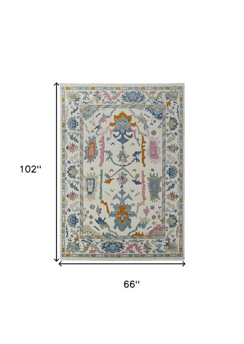 6' x 9' Wool Floral Hand Knotted Area Rug With Fringe - Blue Ivory And Pink