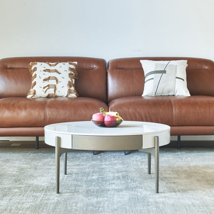 Modern round Giga coffee table with storage drawers, handcrafted ceramic inlay, 2-tone wood legs, ideal for Scandinavian living rooms.