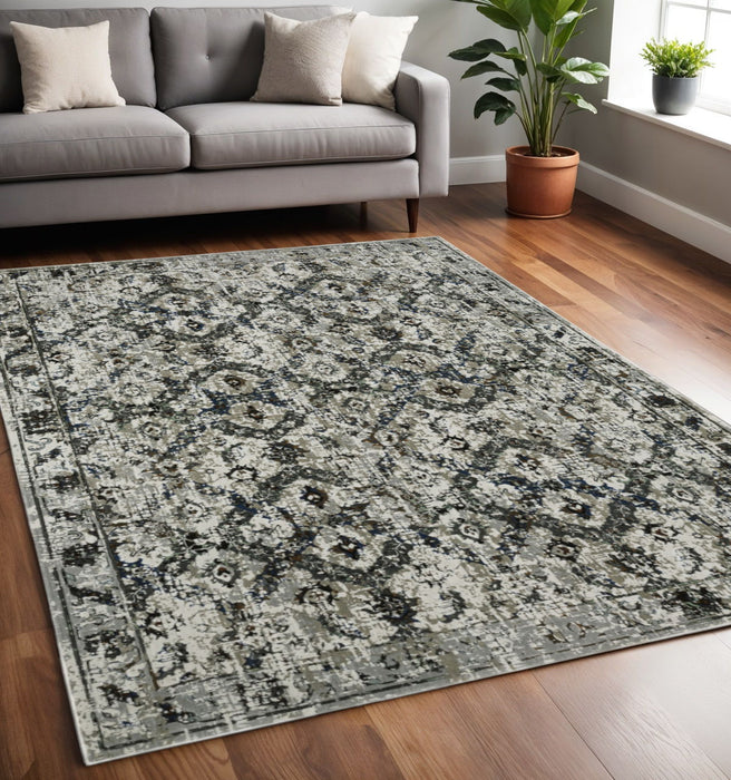 5.3' x 7.6' Oriental Power Loom Stain Resistant Area Rug - Ivory Charcoal Grey Blue Rust Gold And Brown
