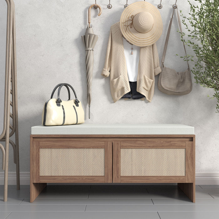 Giga storage bench with cushion and two doors in antique natural finish, featuring rattan accents for shoe storage and seating.