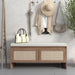 Giga storage bench with cushion and two doors in antique natural finish, featuring rattan accents for shoe storage and seating.