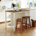 Rustic Giga 3-piece stationary kitchen island set with two seats and open shelves, ideal for dining and kitchen storage.