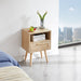 Giga 15.75-inch rattan nightstand with built-in power outlet, USB ports, drawer, and solid wood legs for living room or bedroom.