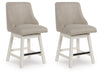 Set of two Robbinsdale Signature Design by Ashley® upholstered swivel curved back barstools in antique white with wooden legs.