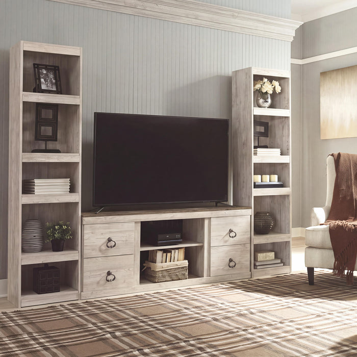 Signature Design by Ashley Willowton entertainment center with fireplace insert, wood finish, and storage cabinets.