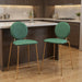 Set of two 26-inch velvet and steel counter height bar chairs in green and gold with modern design and plush upholstery.