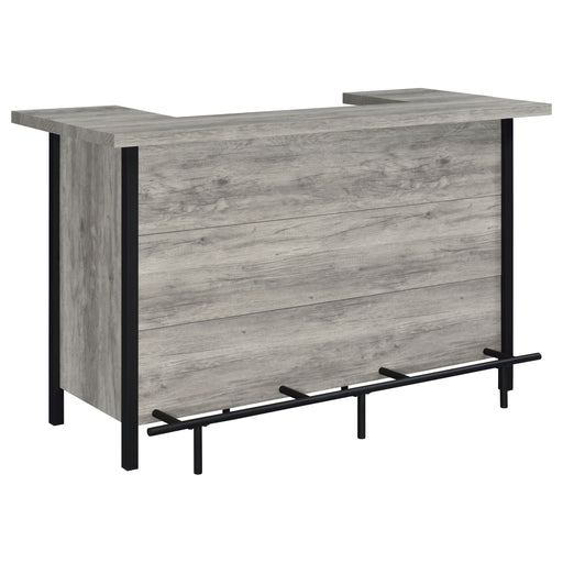 CoasterEssence Bellemore freestanding home bar wine cabinet in grey driftwood finish, showcasing shelves and storage compartments.