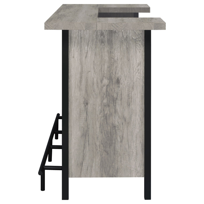 Grey driftwood Bellemore freestanding home bar wine cabinet by CoasterEssence with shelves and storage for bottles and glassware.