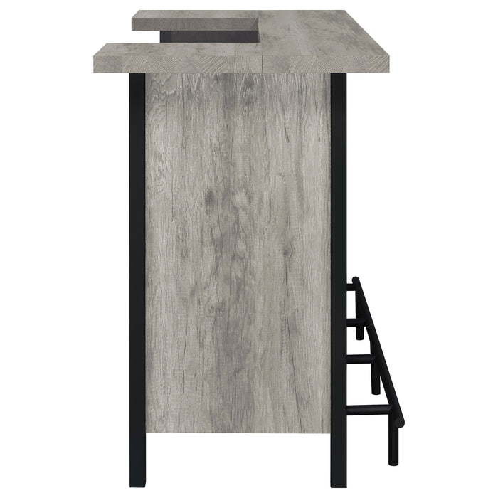 Grey driftwood Bellemore freestanding home bar wine cabinet by CoasterEssence with glass storage and wine rack.