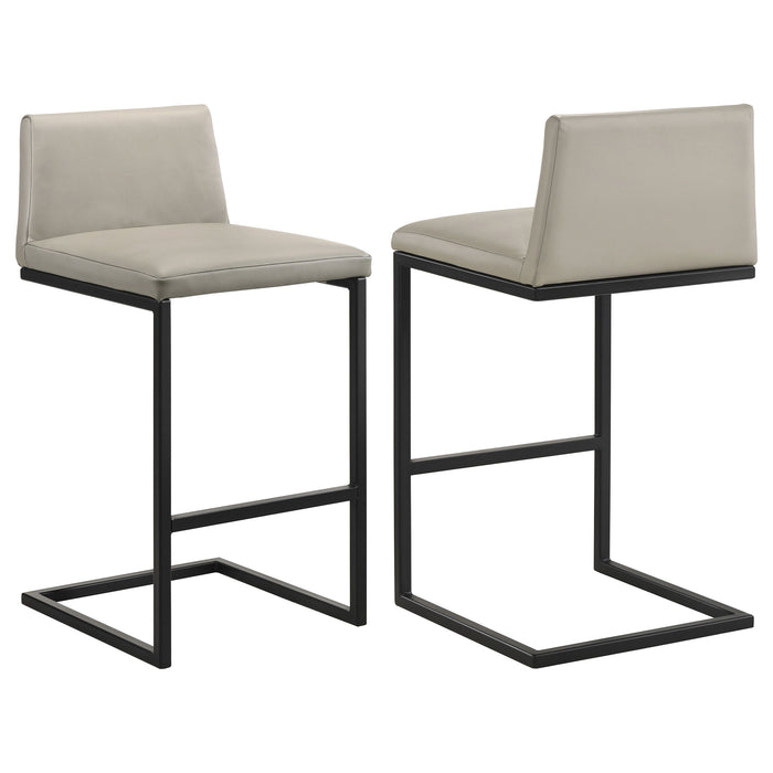 Set of two Vardon genuine leather bar stools in tan, showcasing the stylish, padded seating and sturdy metal legs for modern kitchen decor.