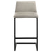 Pair of CoasterEveryday Vardon genuine leather bar stools in tan with metal legs, shown from a side angle.