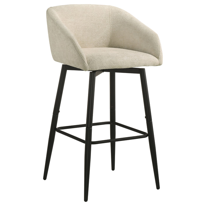 Set of two CoasterEveryday Rainer fabric upholstered swivel bar chairs in cream with modern design and metal bases.