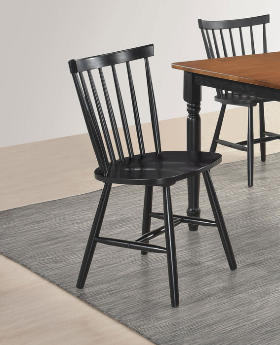 Set of two Hollyoak Windsor wood dining side chairs by CoasterEveryday in black, showing the classic Windsor style with curved spindles.