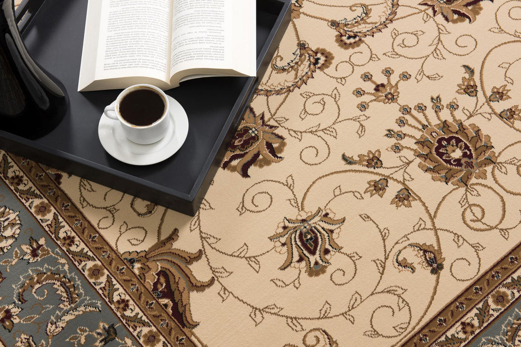 6.5' x 9.3' Oriental Power Loom Area Rug - Blue And Ivory