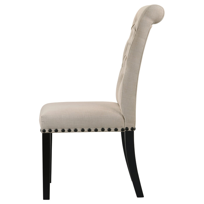 Set of two beige fabric upholstered dining side chairs from CoasterEveryday with wooden legs and padded seats.