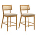 Set of two CoasterEveryday Fabra cane back counter height chairs in honey wheat finish, showcasing woven cane backrests and wooden seats.