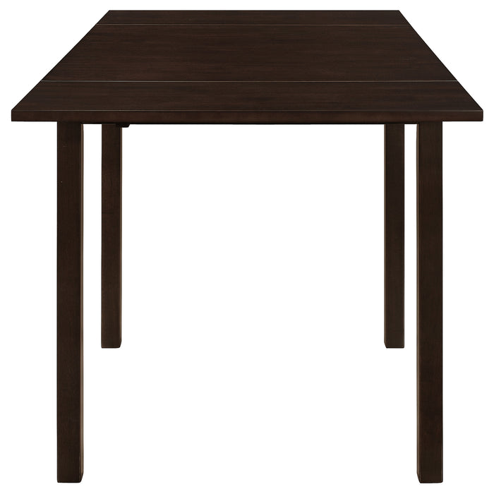 CoasterEveryday Kelso 3-piece drop leaf dining table set with cappuccino and beige finish, showing the table and chairs in a dining room setting.