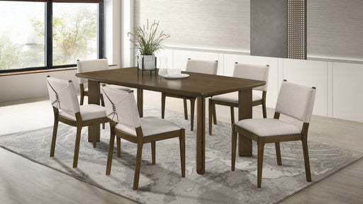 Ottowa 7-piece rectangular brown wood dining table set by CoasterEveryday with matching chairs in a modern dining room.