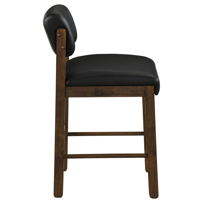 Pair of black and walnut Kehoe upholstered counter height chairs by CoasterEveryday, featuring modern design and padded seats.