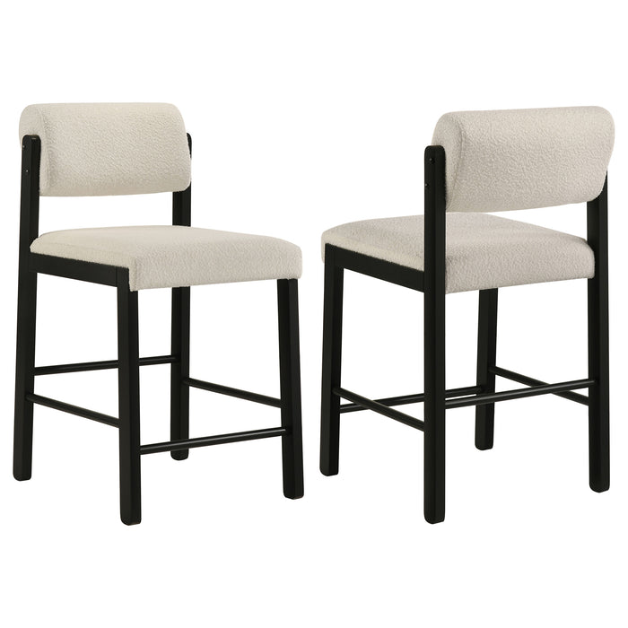 Set of two CoasterEveryday cream and black upholstered counter height chairs with padded seats and backs.