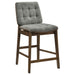 Set of two Redbridge upholstered counter chairs by CoasterEveryday, featuring grey fabric seats and walnut wood legs.