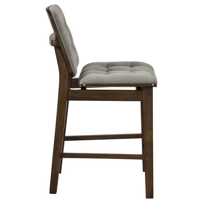 Set of two Redbridge upholstered counter chairs by CoasterEveryday with grey fabric seats and walnut wood legs.