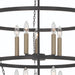 HomeRoots black and gold candle style ten-light metal chandelier with dimmable feature and elegant design.