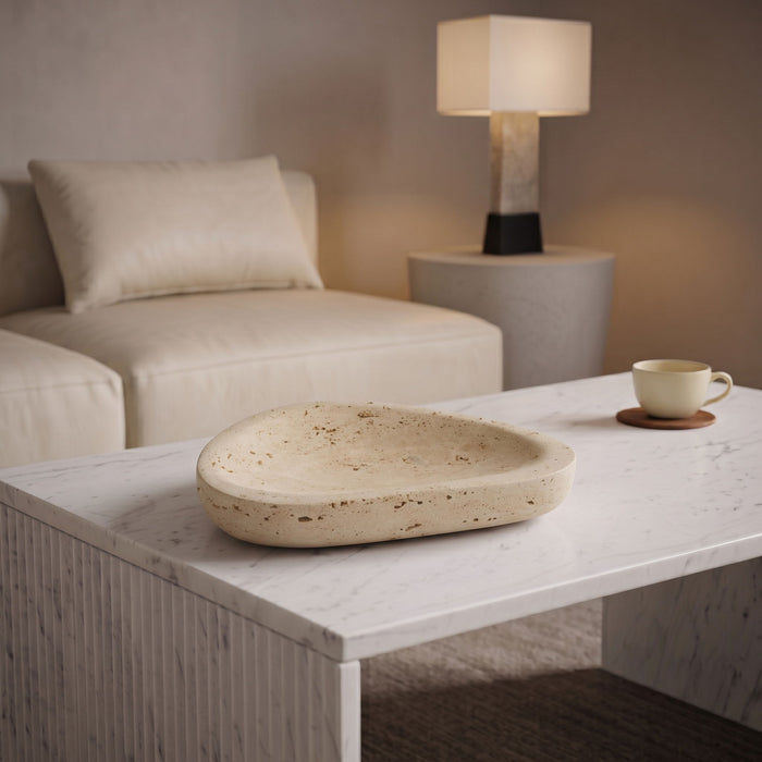 Meridian Furniture Whelan Travertine Bowl, a stylish ceramic plate with a textured travertine finish, ideal for serving or display.
