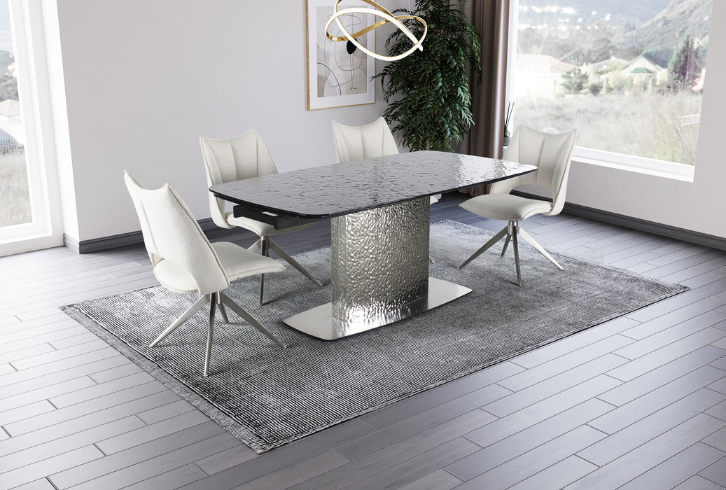 Contemporary NORA extendable dining table by Chintaly with gloss black textured glass top and stainless steel base, shown extended.