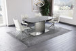 Contemporary NORA extendable dining table by Chintaly with gloss black textured glass top and stainless steel base, shown extended.