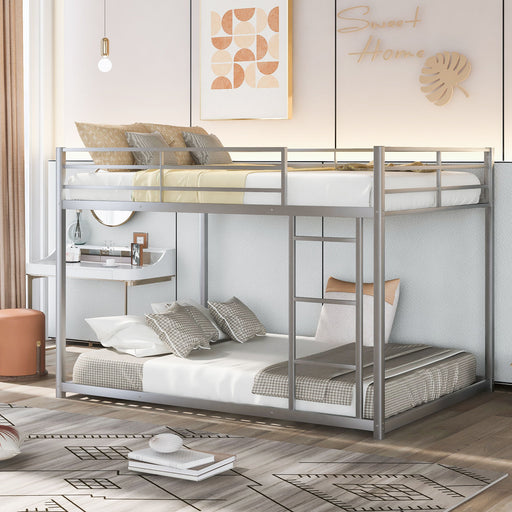 Giga metal bunk bed with a low profile and built-in ladder, featuring a sturdy silver frame and safety rails for top bunk.