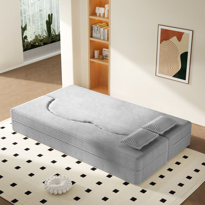 Giga floor sofa with two pillows and convertible twin size mattress, ideal for living room seating and lounging.