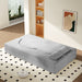 Giga floor sofa with two pillows and convertible twin size mattress, ideal for living room seating and lounging.