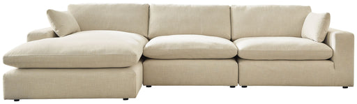 Benchcraft Elyza 3-piece stationary sectional sofa with plush cushions and modern design, shown in a cozy living room setting.