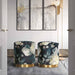 Dark gray floral velvet ottoman with gold base by TOV Furniture, featuring plush upholstery and elegant design.
