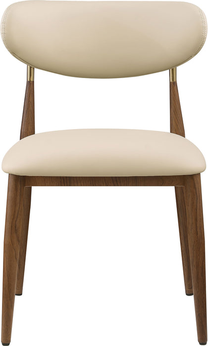 Vegan leather upholstered Meridian Furniture Ronda dining side chair with walnut wood legs, modern and comfortable seating.