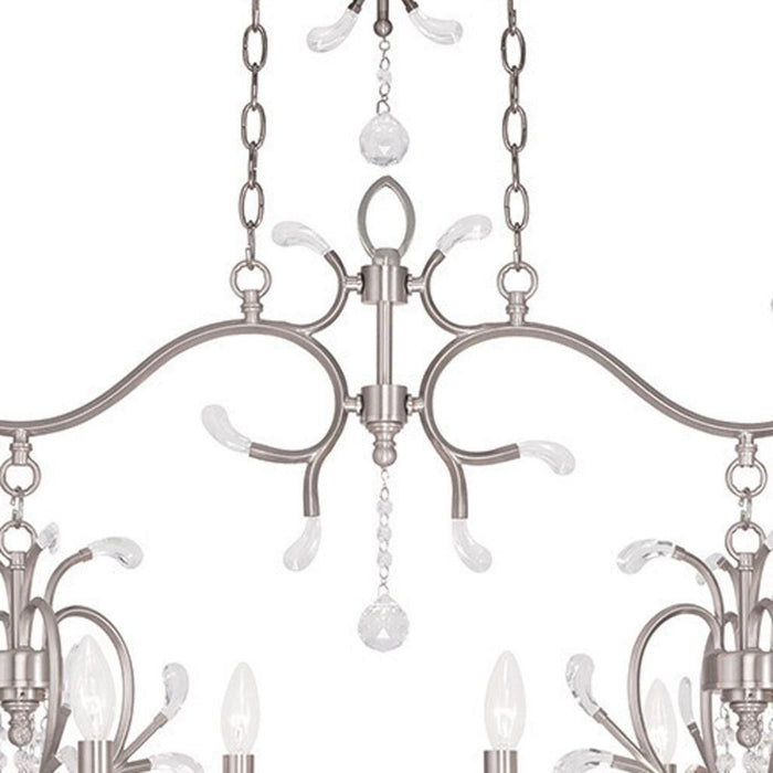 HomeRoots 29-inch metal chandelier with eight clear shades, dimmable lighting, and nickel finish, modern design for elegant interiors.