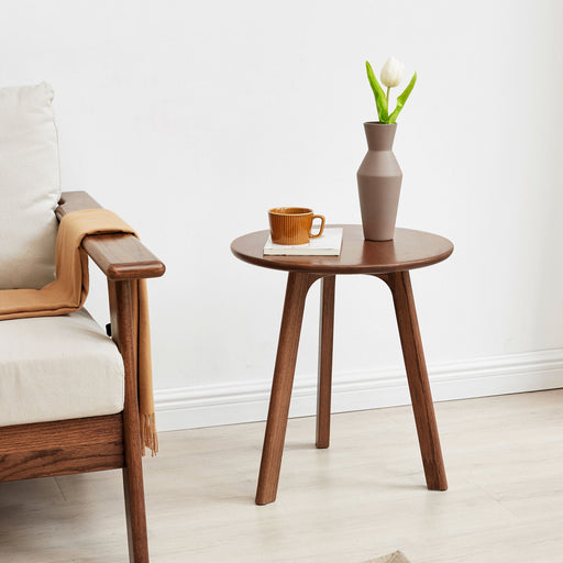 Small round Giga end table for bedroom or balcony, side table with a sleek design and compact size.