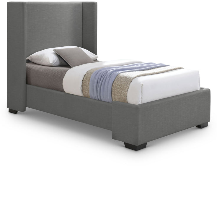 Upholstered Oxford bed by Meridian Furniture with a plush fabric headboard and wooden frame in a cozy bedroom setting.