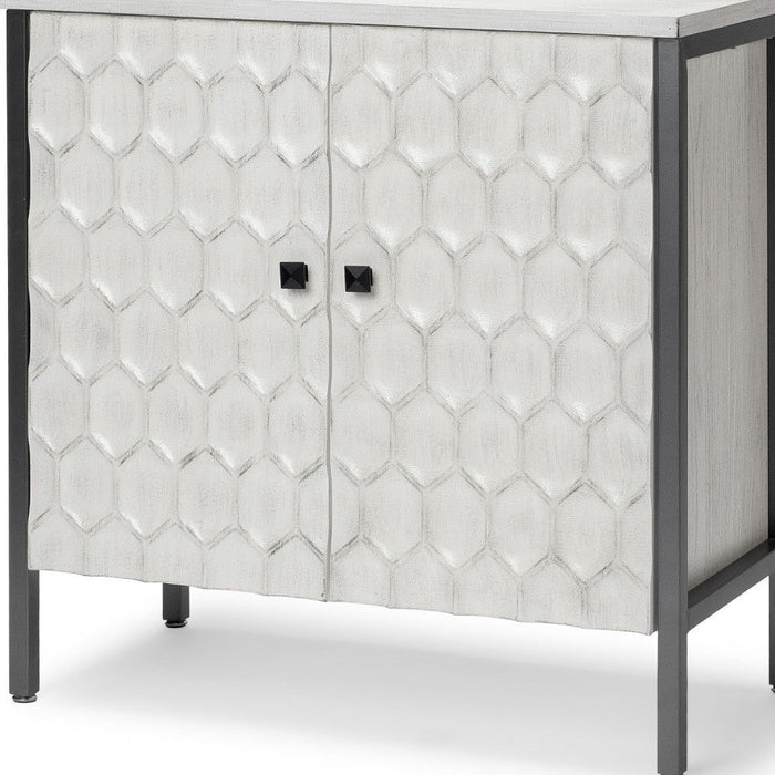Gray and white 32-inch wood and metal carved geometric accent cabinet with two doors by HomeRoots.