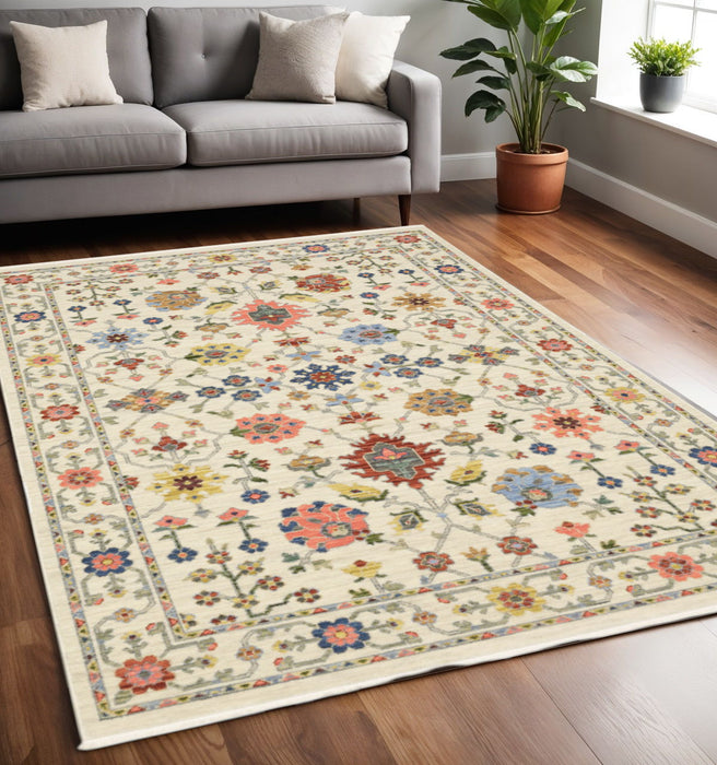 5' x 8' Oriental Power Loom Stain Resistant Area Rug With Fringe - Ivory Salmon Pink Gold Blues Gray Rust And Green